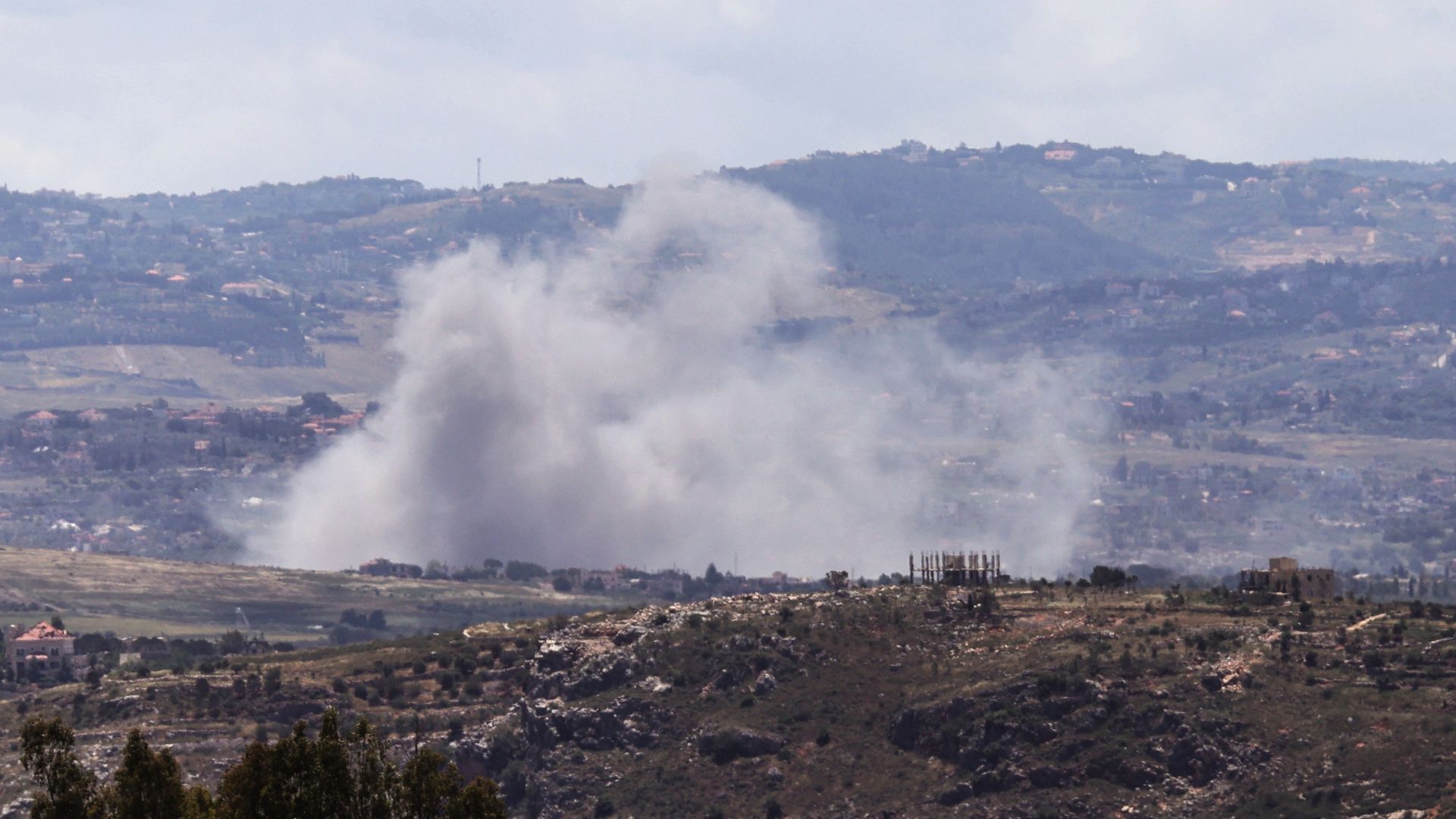 Smoke rises over the southern Lebanese village of Deir Siriane following explosions carried out by the Israeli army on May 20, 2026. /AFP
