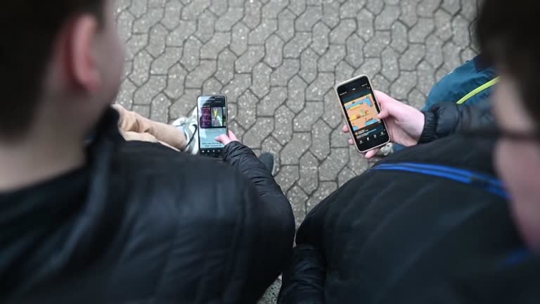 Some places allow children to keep their phones, while others insist they hand them in for the course of the day. /Reuters