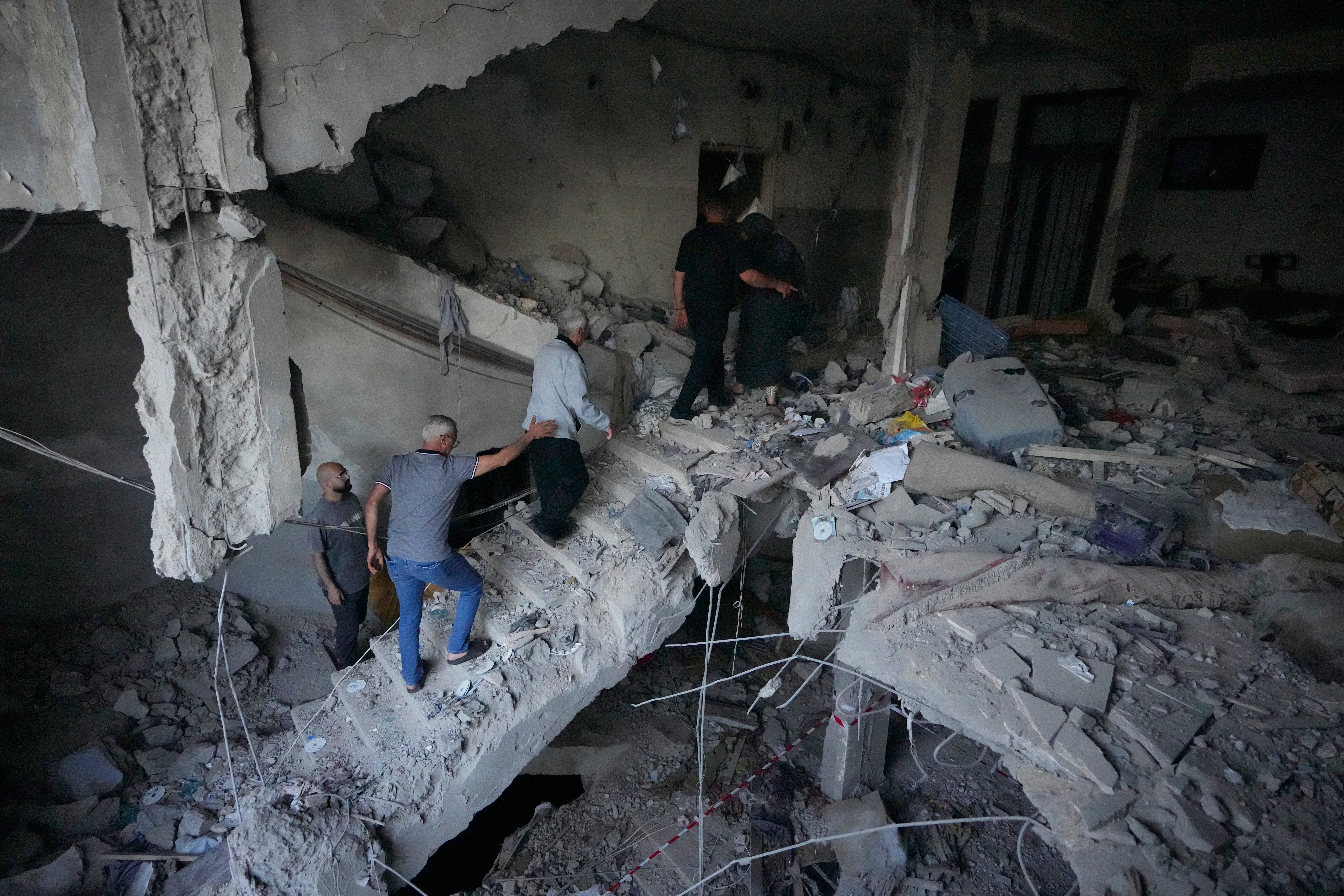 People check a destroyed apartment that was hit in an Israeli airstrike in the southern port city of Sidon, Lebanon, Thursday, May 28, 2026. /Mohammed Zaatari/AP