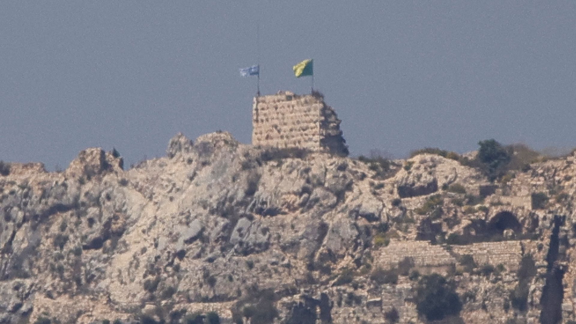 This picture taken from Marjayoun, southern Lebanon, shows an Israeli flag and a Golani Brigade flag fluttering atop the medieval Beaufort Castle in Arnoun on June 1, 2026.  /AFP
