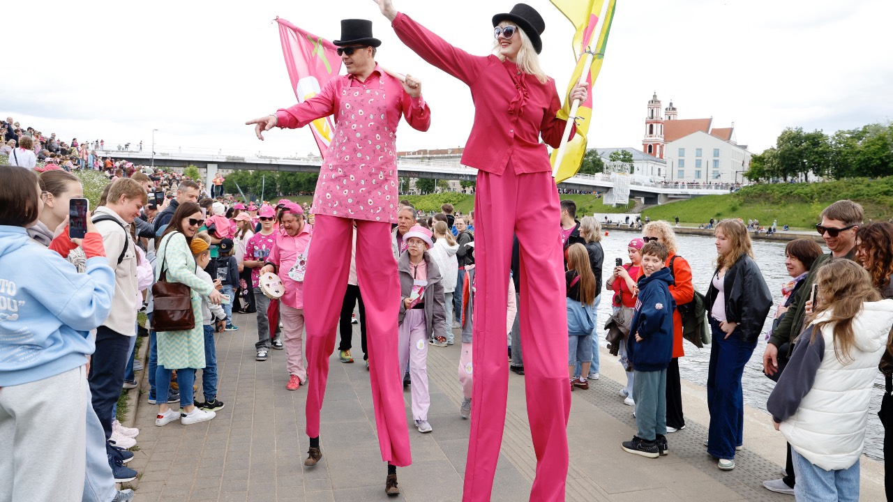 Participants on stilts during the annual event celebrating the 'Saltibarsciai' beetroot soup in Vilnius, Lithuania. /Petras Malukas/AFP