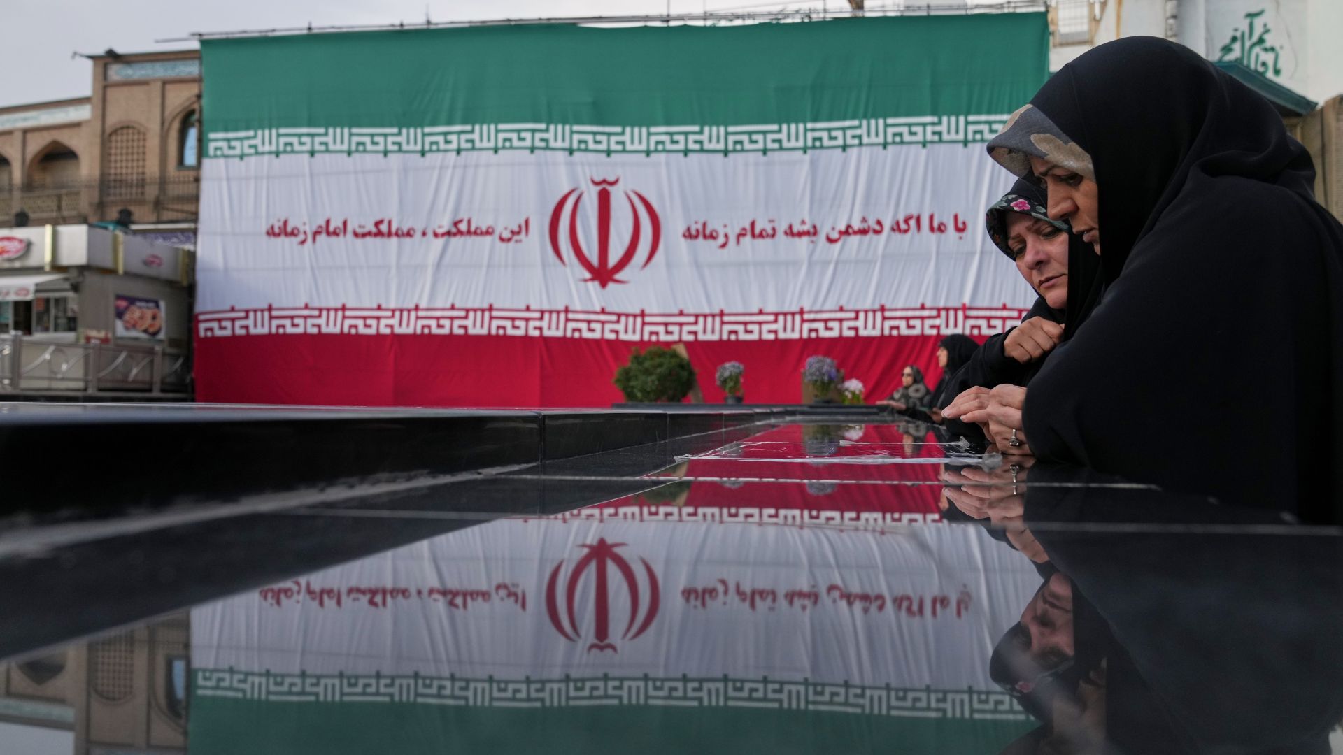 Women pay their respects at a memorial to the unknown soldier and nuclear scientists killed during the 2025 Twelve-Day War, at the Emamzadeh Saleh Shrine in Tehran on April 7. /Francisco Seco/AP