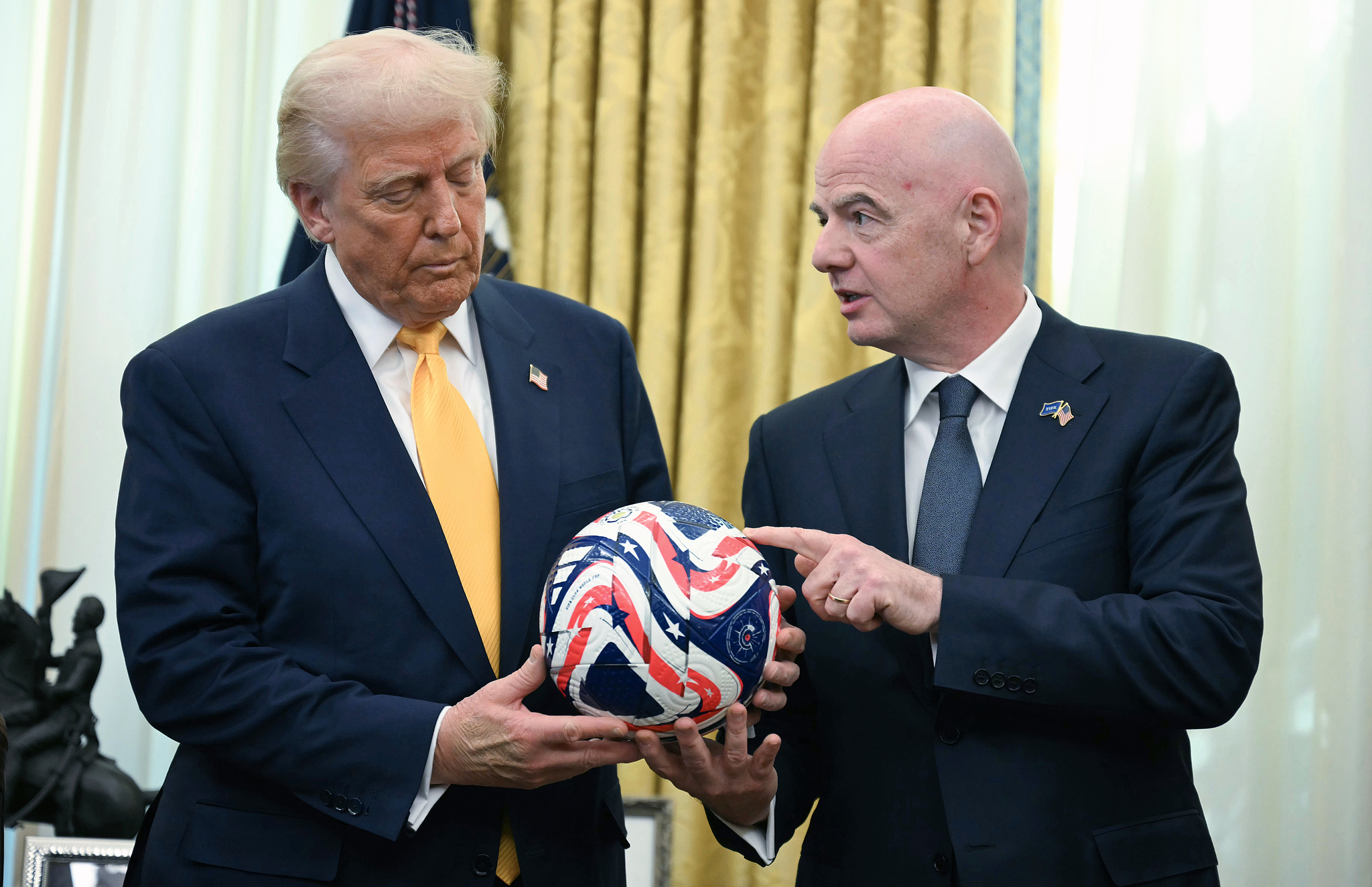 US President Donald Trump (left) said last month that Iran could play in the World Cup if FIFA President Gianni Infantino (right) approved. /CFP 