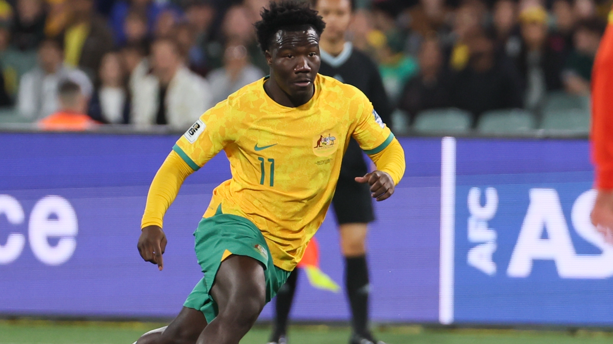 Australia's Nestory Irankunda in action during the World Cup qualifying soccer match between Australia and China at Adelaide Oval, Adelaide last October. /James Elsby/AP