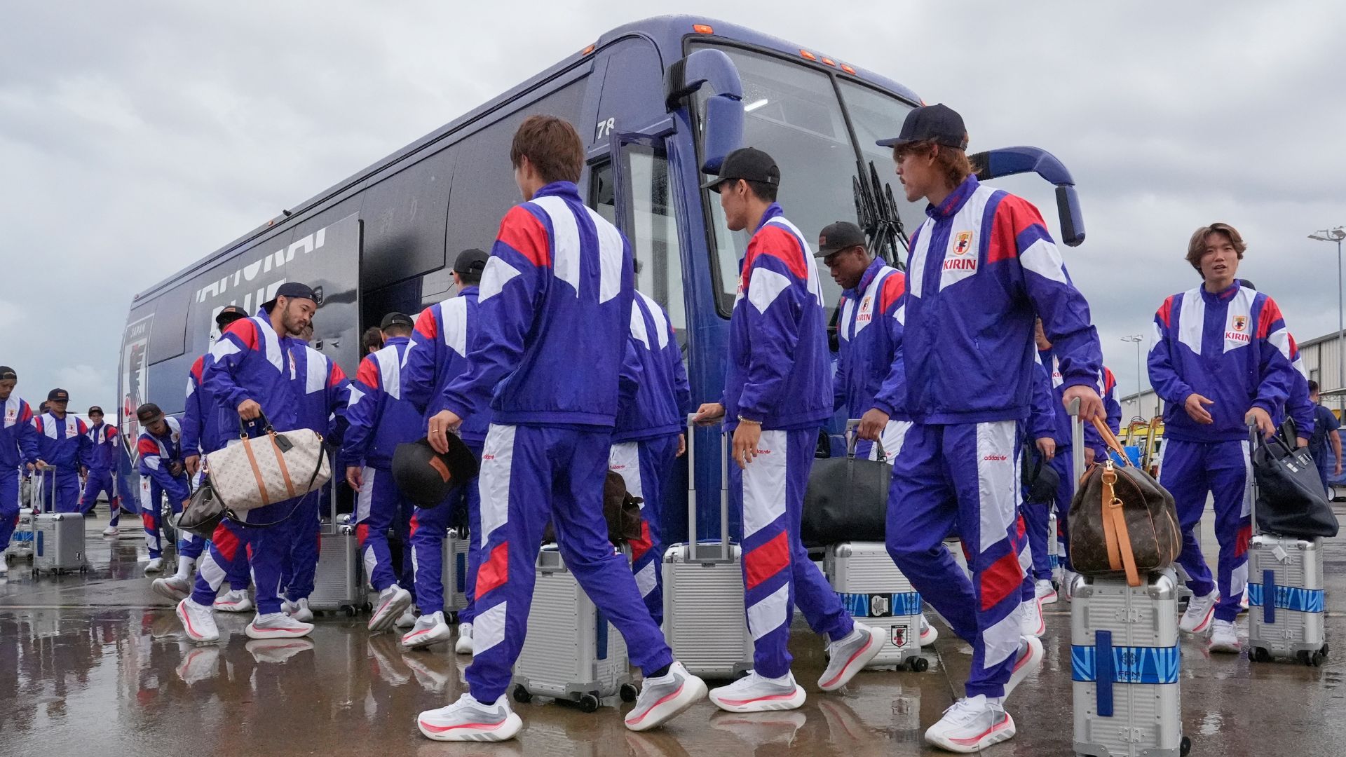 Japan's players arrive for the World CUp on their team bus. They are allowed on the pitch, but the bus is not. /George Walker IV/AP Photo