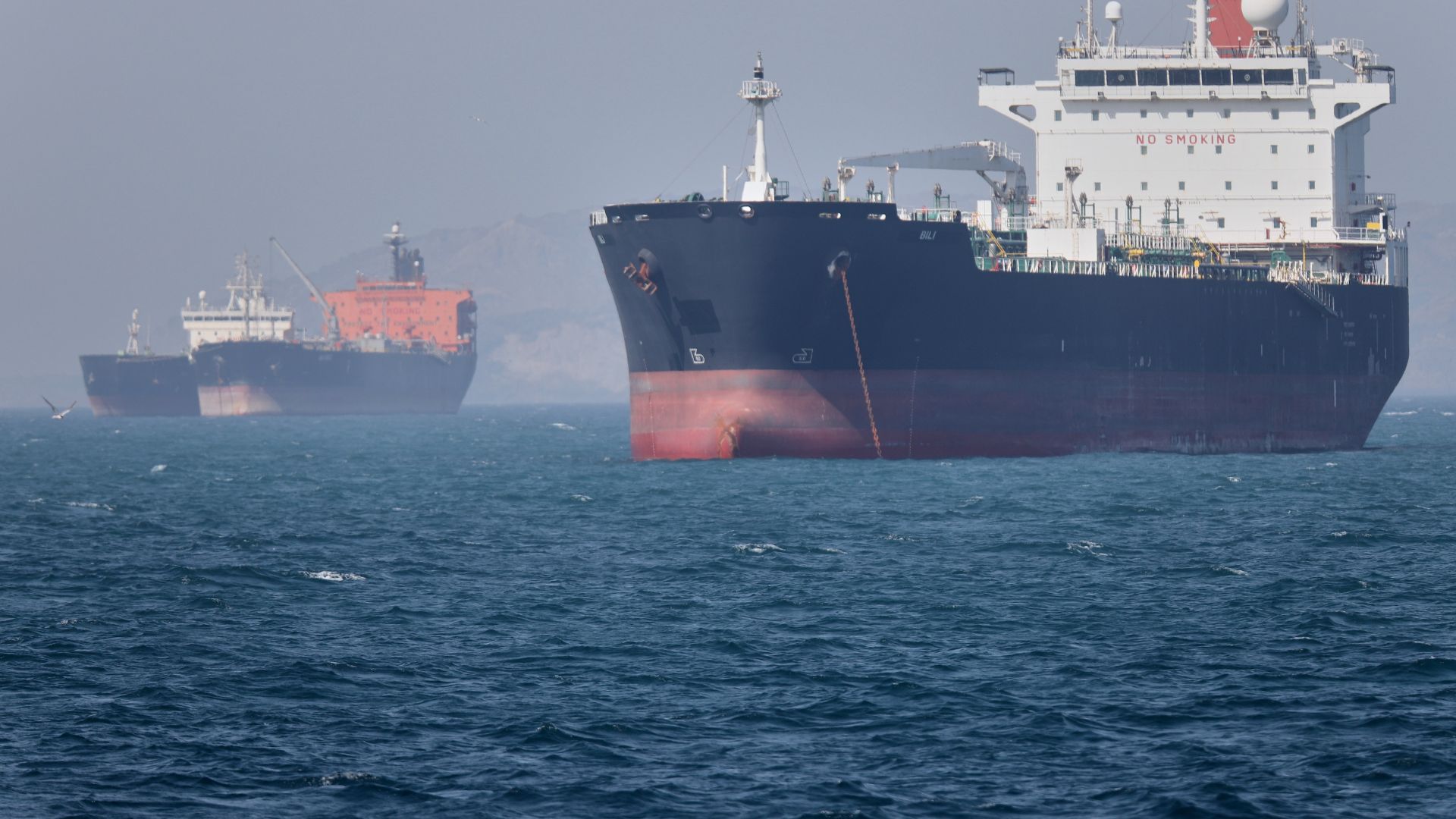 Oil tankers wait in the Strait of Hormuz. /AP