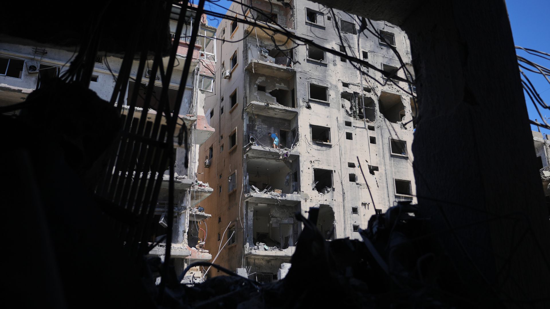 Apartment blocks in the Lebanese city of Tyre reckon with significant damage, after a barrage of strikes from the Israeli military earlier this month. / AP.