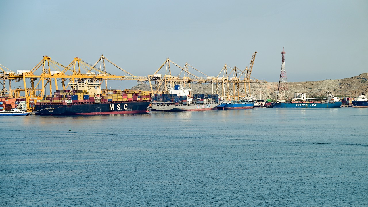 The Liberia-flagged container vessel MSC Tasman VI, the Singapore-flagged container vessel Wan Hai 353, and other ships are docked along a pier at the Khor Fakkan Container Terminal, the only natural deep-sea port in the region and one of the major container ports in Sharjah Emirate, along the Gulf of Oman. /AFP