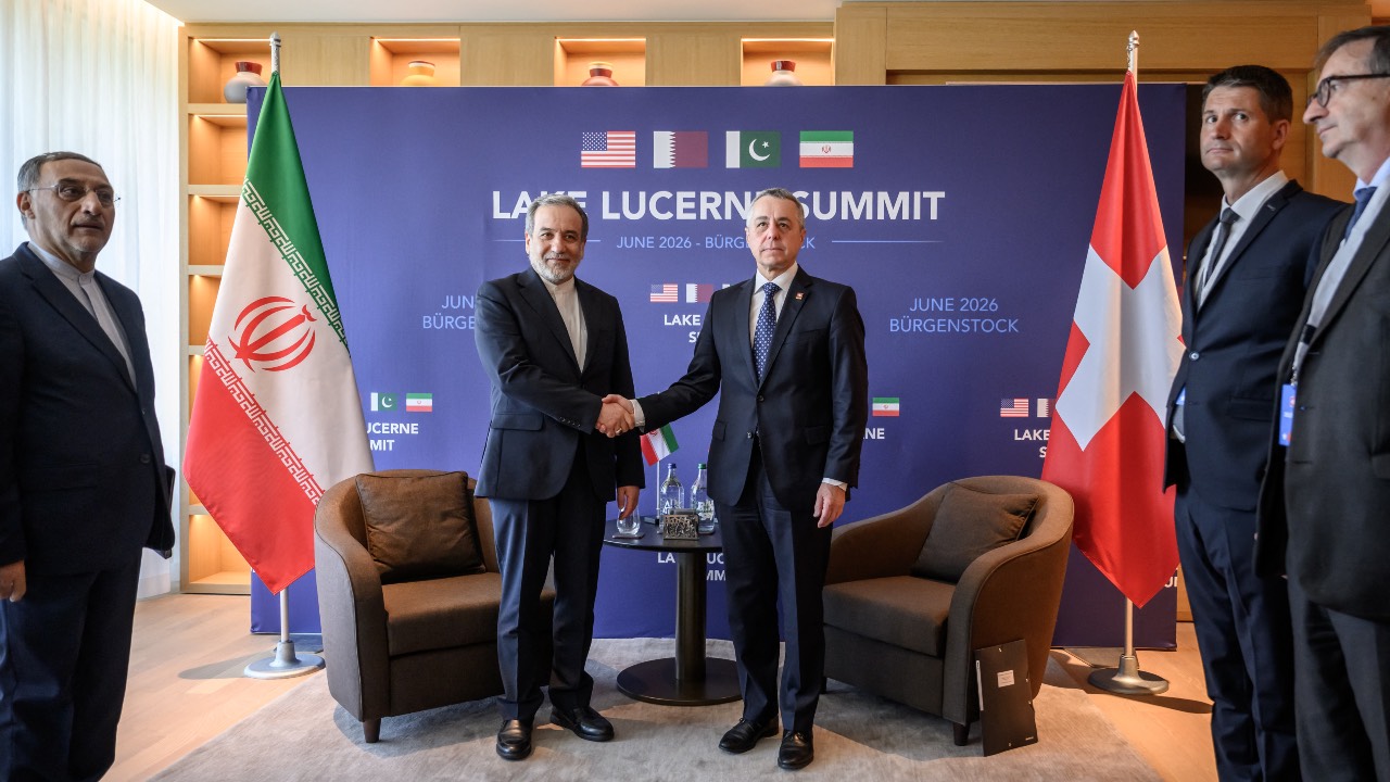 Iran's Foreign Minister Abbas Araghchi (L) shakes hands with Switzerland's Foreign Minister Ignazio Cassis at the Buergenstock luxury hotel complex overlooking Lake Lucerne, Switzerland. Fabrice Coffrini/AFP