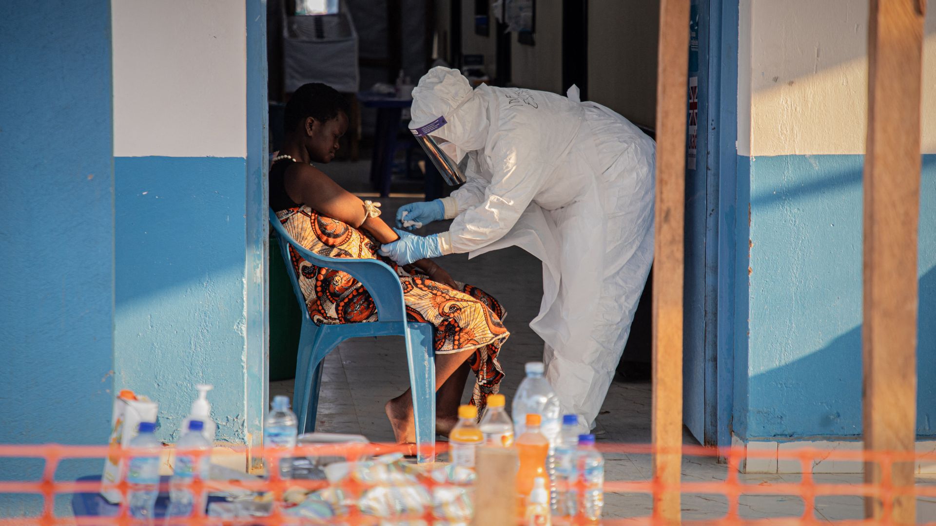 A healthcare worker takes samples from a patient suffering from Ebola virus disease at the Ebola Treatment Center of the Center Médical Évangélique (CME), in Bunia, in the DRC on Tuesday. /Benediction Murhabazi/AFP
