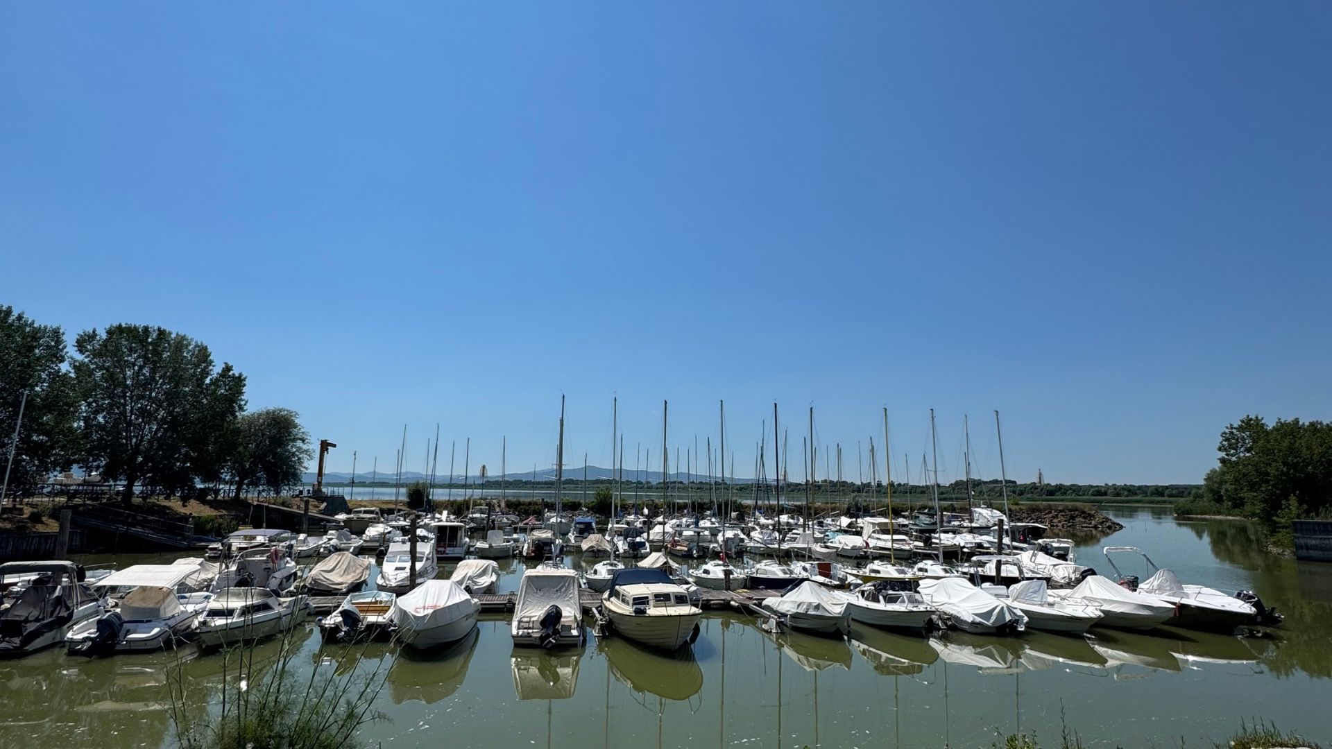 Leisure and tourist activities like sailing could be impacting by the rapidly falling water levels in Lake Trasimeno. /CGTN