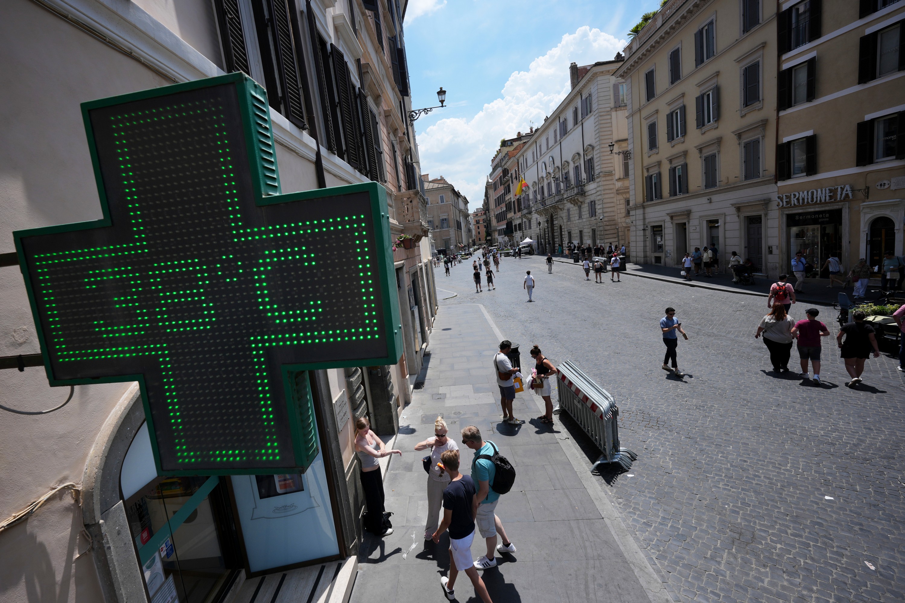 Limit time outdoors during the hottest hours, especially in direct sunlight, where temperatures can be higher than official readings. /Andrew Medichini/AP