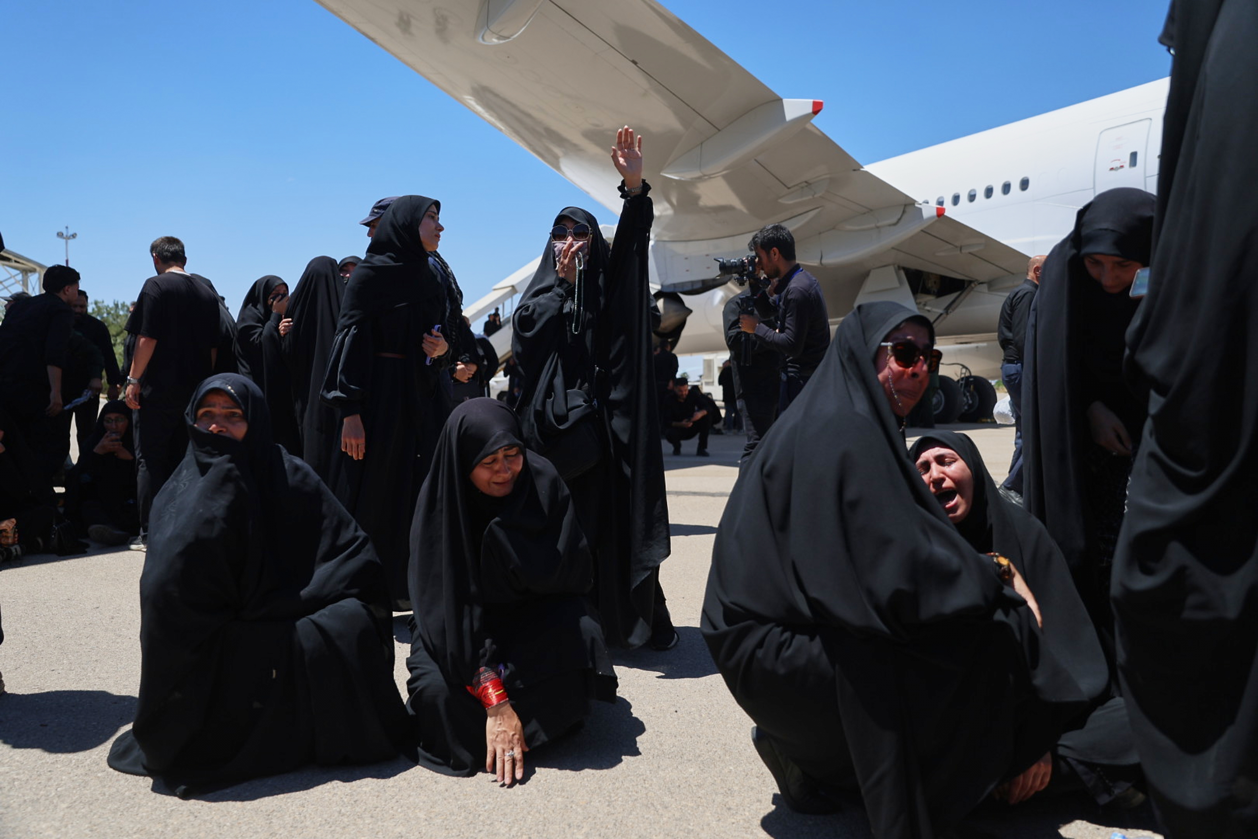 Women react as the coffin of the late Iranian Supreme Leader Ayatollah Ali Khamenei arrives in Mashhad, Thursday, July 9, 2026. /AP