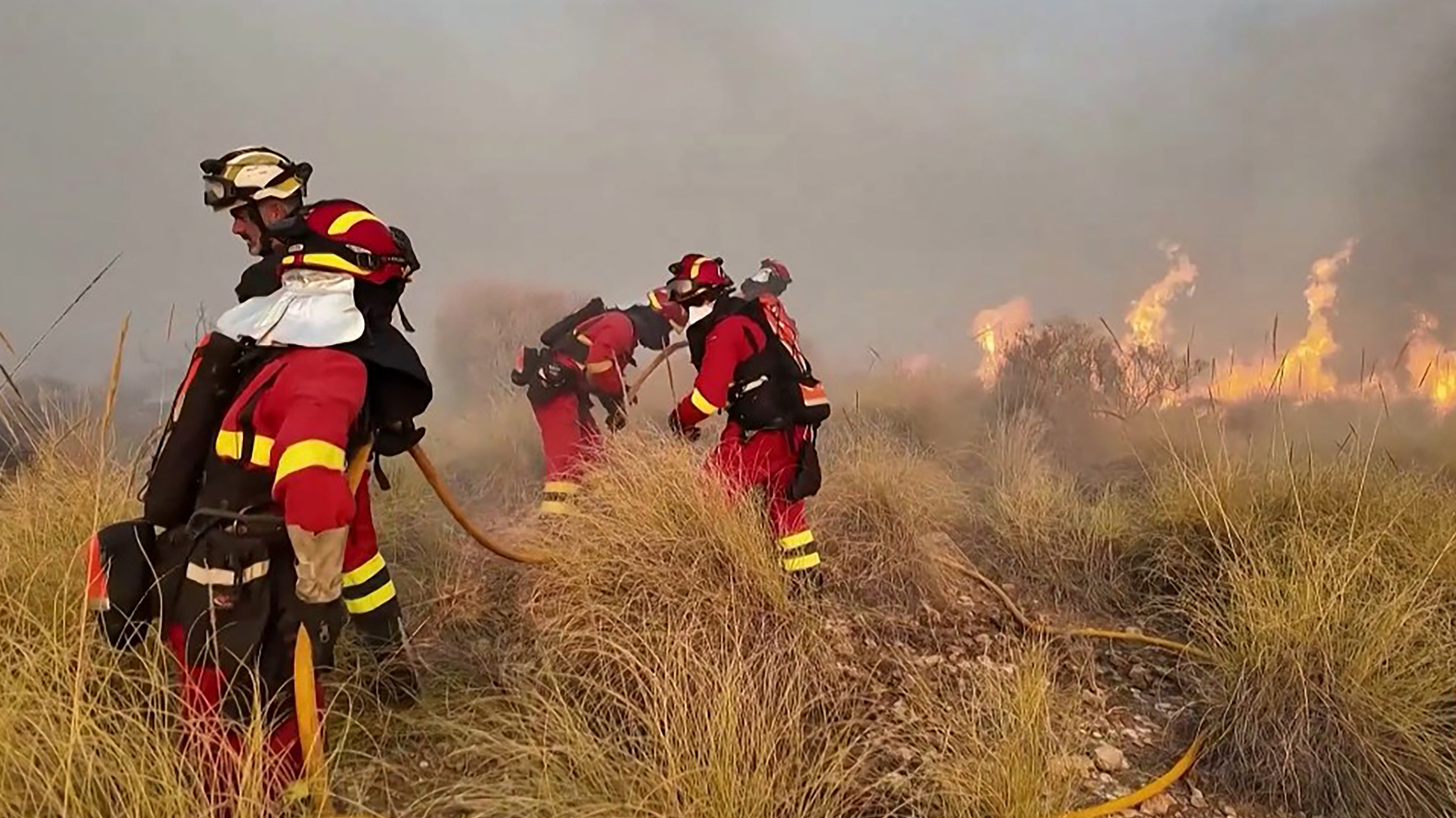 At least 12 dead, 19 missing as wildfire roars through southern Spain