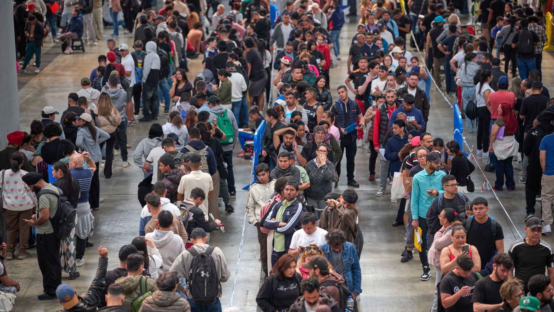 Migrants queue at a public service office to obtain paperwork needed to apply for Spain's immigration amnesty. /Emilio Morenatti/AP Photo