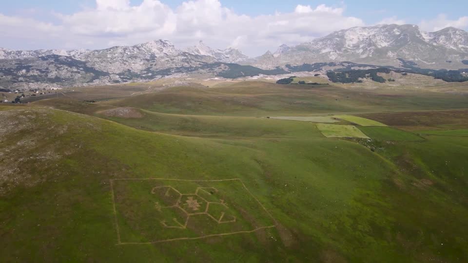 Artists carve giant grass sculptures into a Montenegro national park