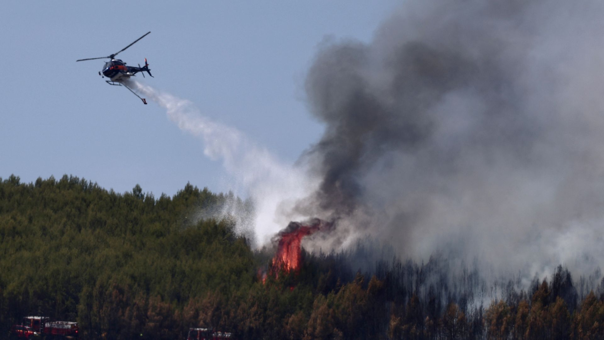 In southern France, plumes of smoke underscore the greenhouse gas emissions entering the atmosphere as the forest burns. /AfP.