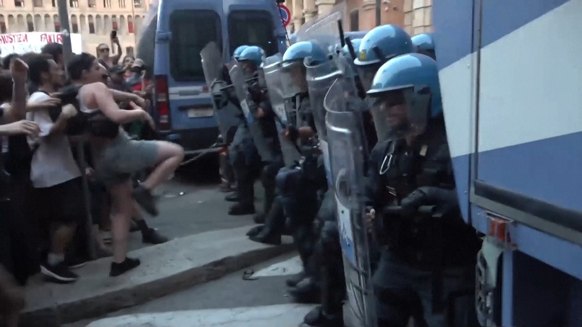 Protesters and riot police square up in Bologna. /AGTW/Reuters
