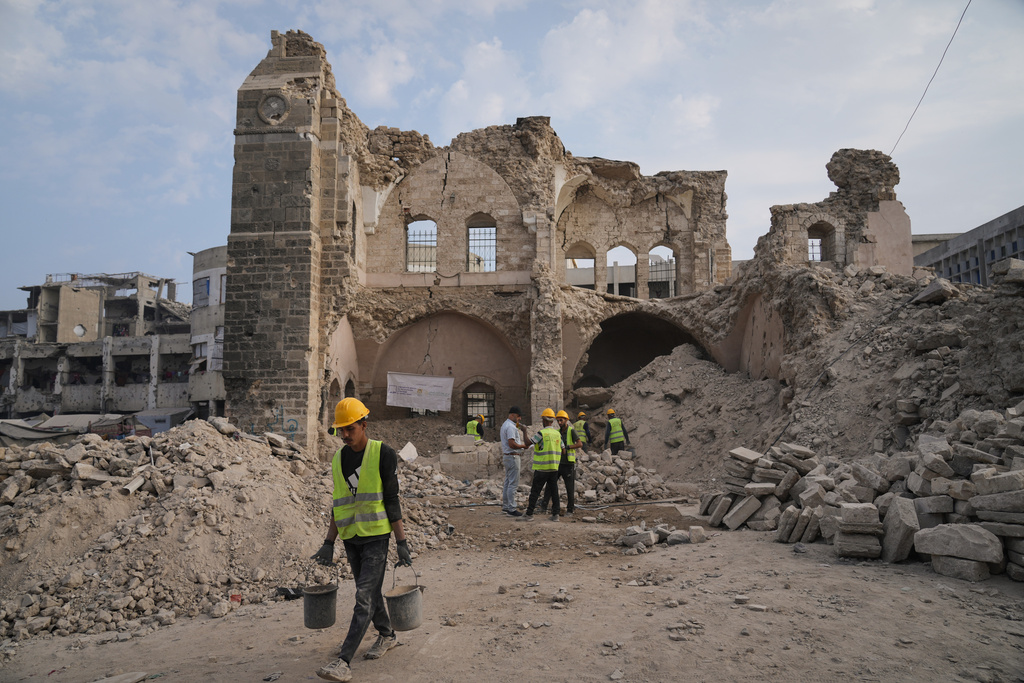 Workers carry out recovery projects and search for missing artifacts at the Pasha Palace in Gaza City after an Israeli strike damaged it during the war with Hamas. /Jehad Alshrafi/AP