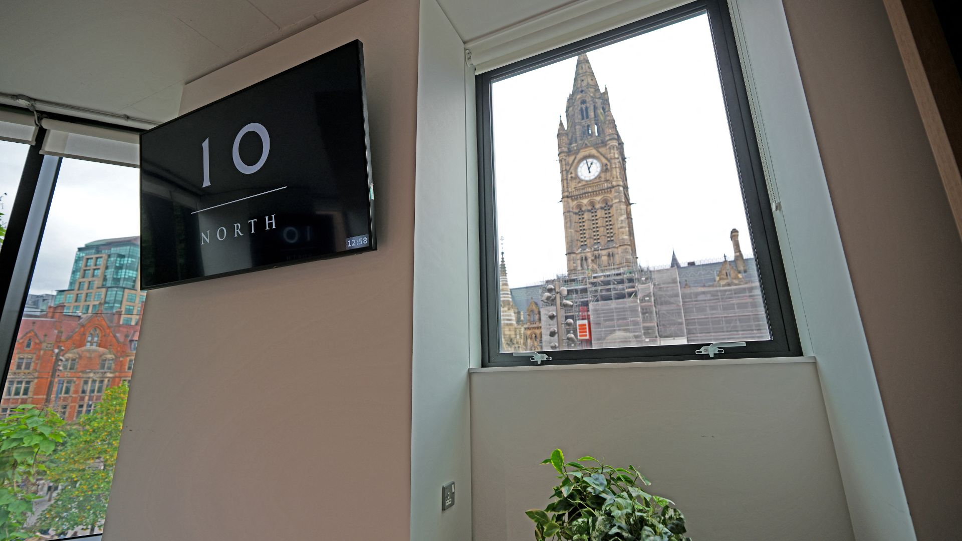 While it's not quite Big Ben, Heron House in Manchester's Albert Square looks out onto the city's clock tower on the Town Hall. /AFP