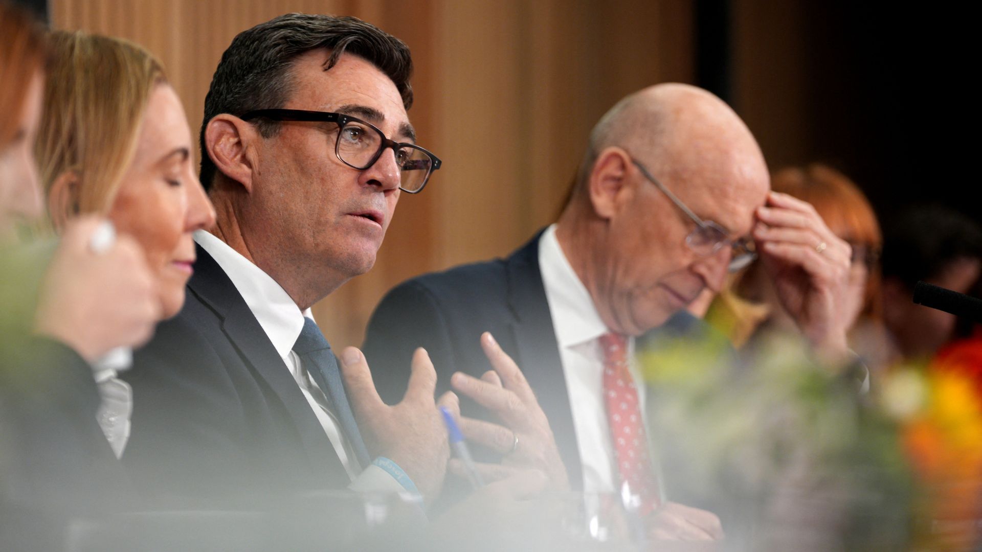 Britain's prime minister Andy Burnham sits beside key allies Louise Haigh and John Healey in his first day in the northern outpost. /AFP