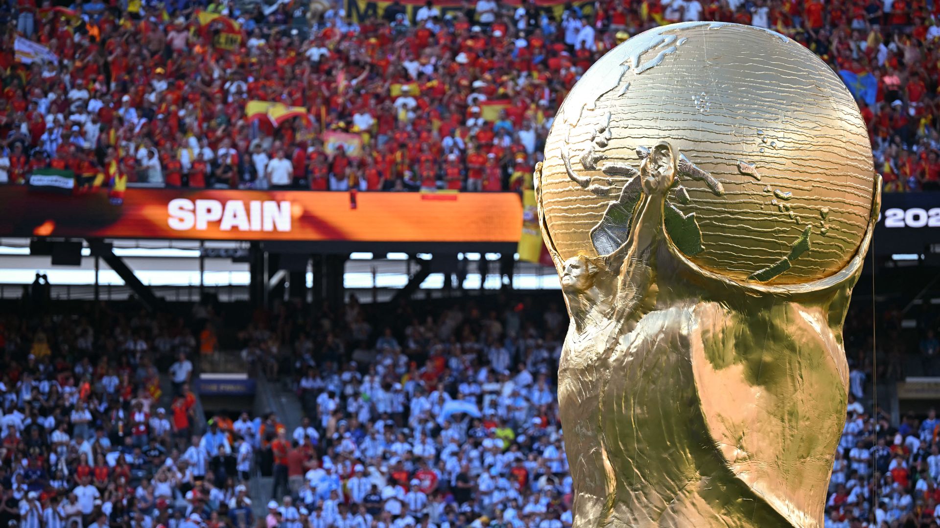 A huge replica of the World Cup trophy at the end of the 2026 World Cup final, won by Spain – who may not defend their trophy, if the UEFA boycott of the next World Cup xcomes to pass. /Paul Ellis/AFP