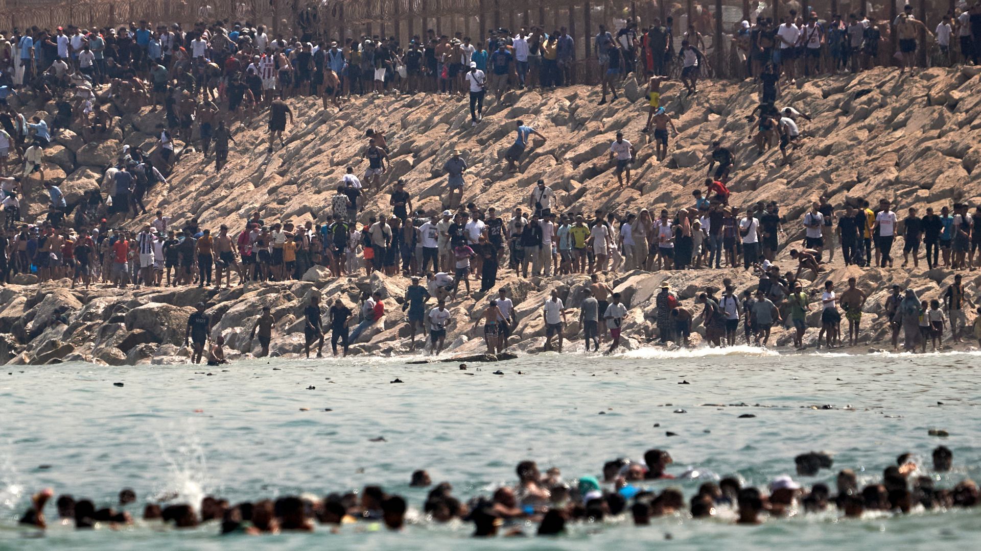 Migrants cross from Morocco into the Spanish enclave of Ceuta, Thursday, July 30, 2026. /Antonio Sempere/AP
