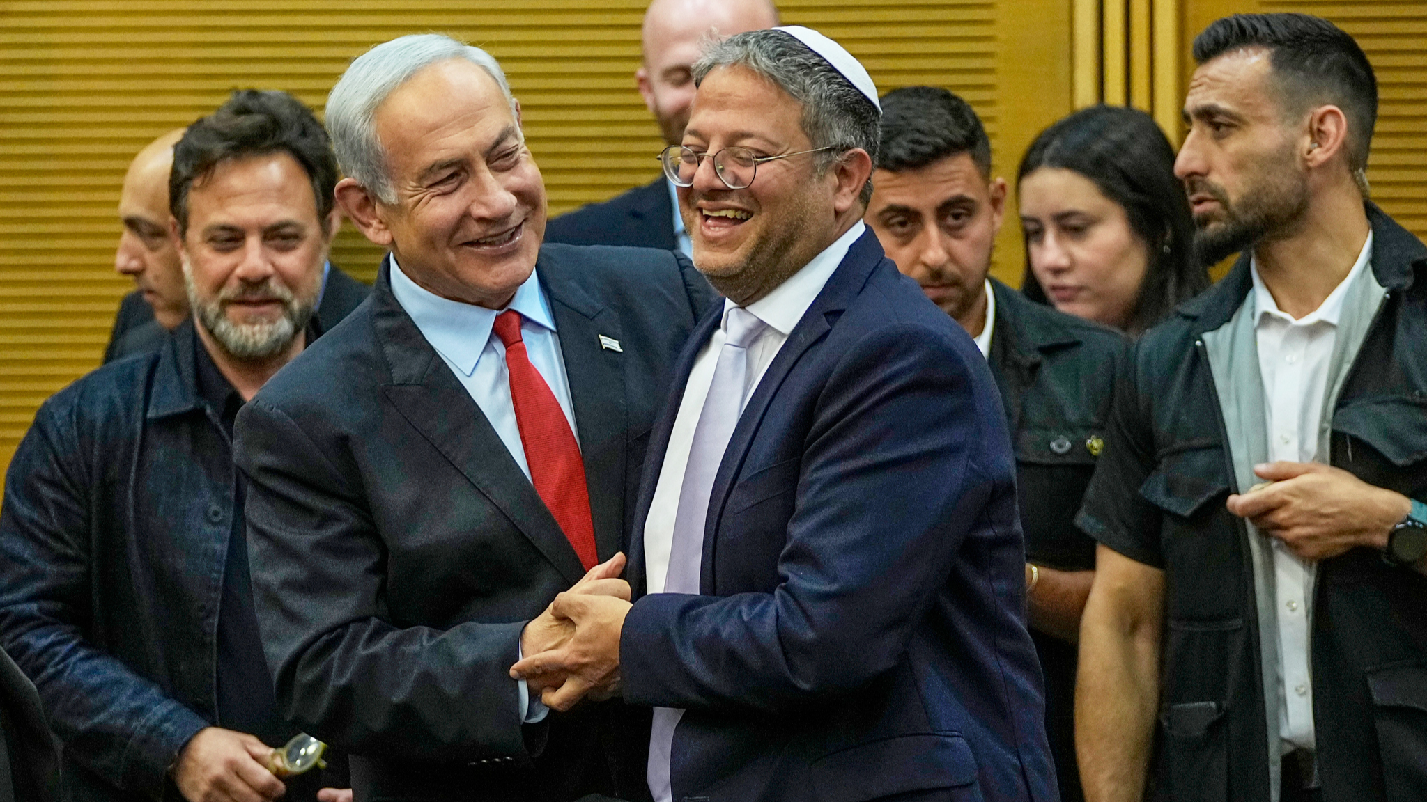 Israeli Prime Minister Benjamin Netanyahu and Israel's National Security Minister Itamar Ben-Gvir smile in the Knesset, Israel's parliament in Jerusalem. /Ohad Zwigenberg via AP