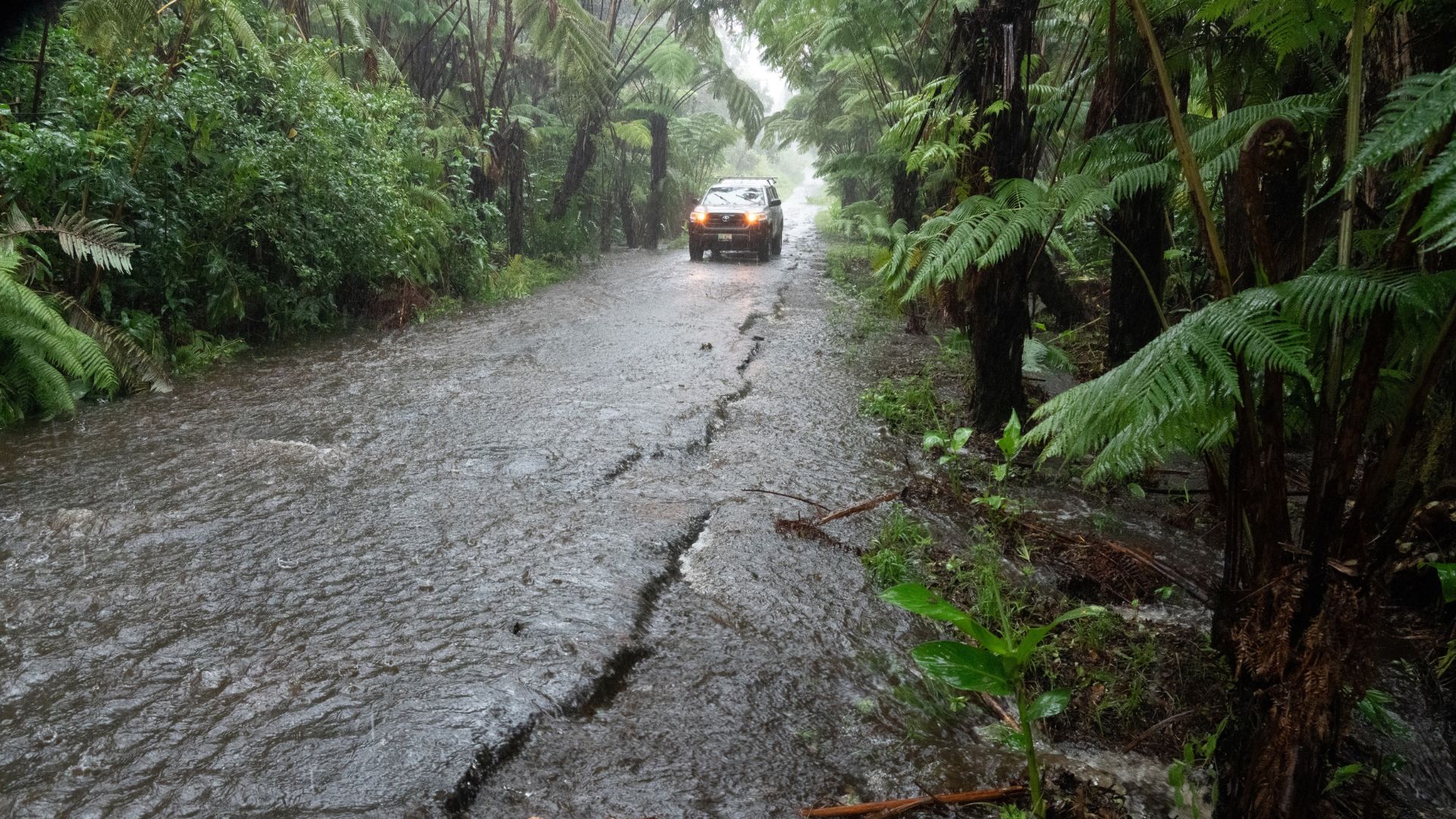 A rural road floods in Volcano Village on Hawaii Island, on August 15. /Jill K. Briggs /AFP
