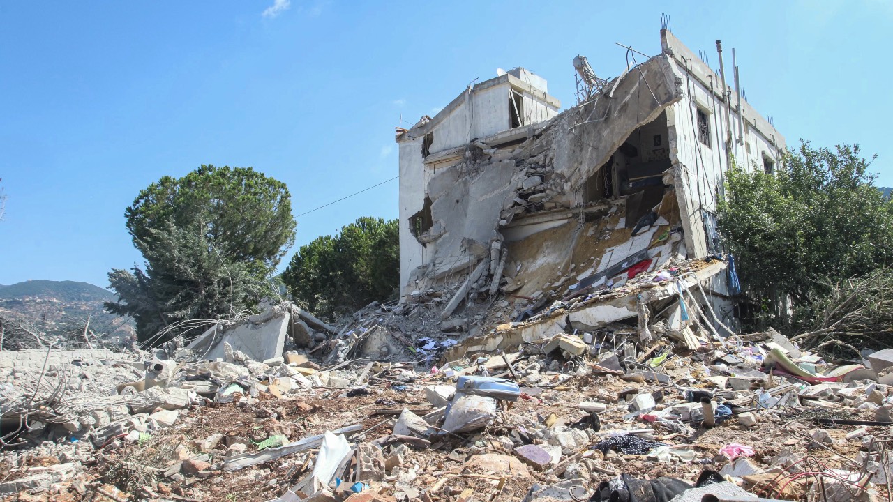 A destroyed building targeted by an Israeli airstrike in the southern Lebanese village of Arabsalim, the latest escalation amid a fragile truce. /Mahmoud Zayyat/AFP