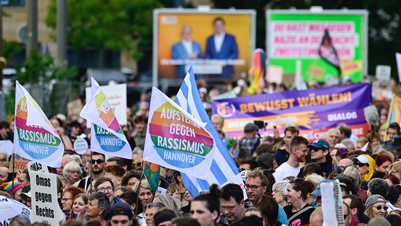 People gather to demonstrate for an open society based on solidarity during a festival of democracy in Magdeburg, eastern Germany. /John MacDougall/AFP