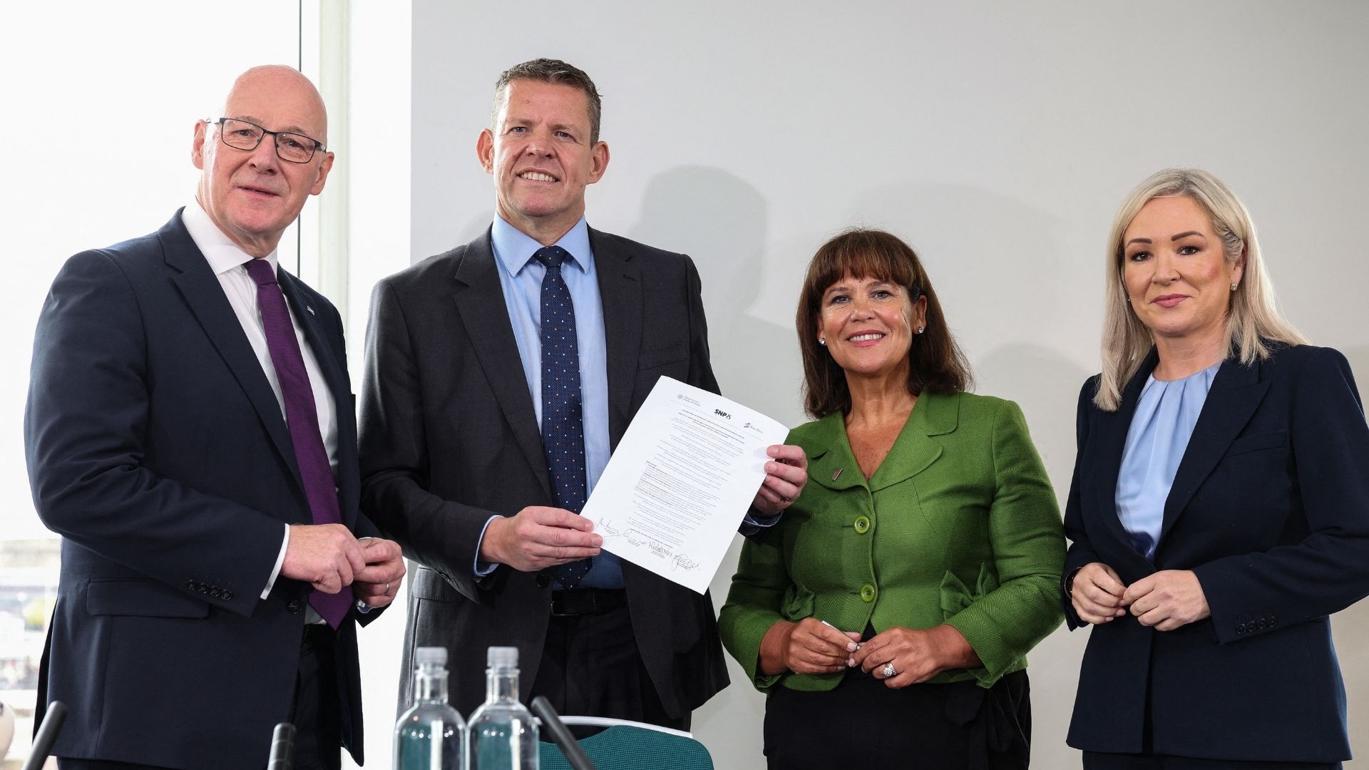 (L to R) Scottish Nationalist Party (SNP) leader John Swinney, Rhun ap Iorwerth of Plaid Cymru in Wales, Mary Lou McDonald, president of Sinn Fein and Michelle O'Neill, vice president of Sinn Fein pose together with the MoU. /Adrian Dennis/AFP
