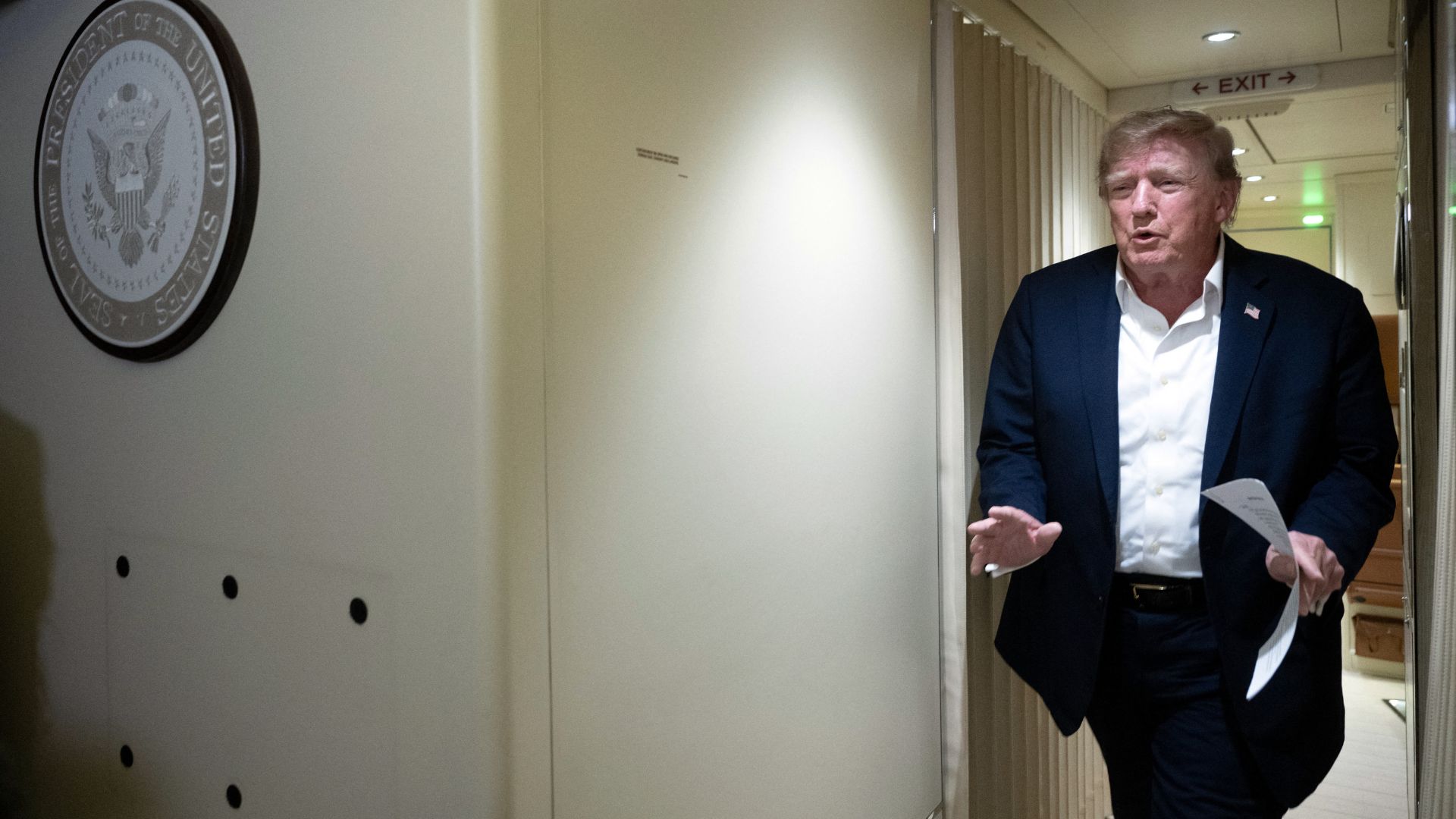 US President Donald Trump approaches reporters aboard Air Force One on September 13. /Brendan Smialowski/AFP
