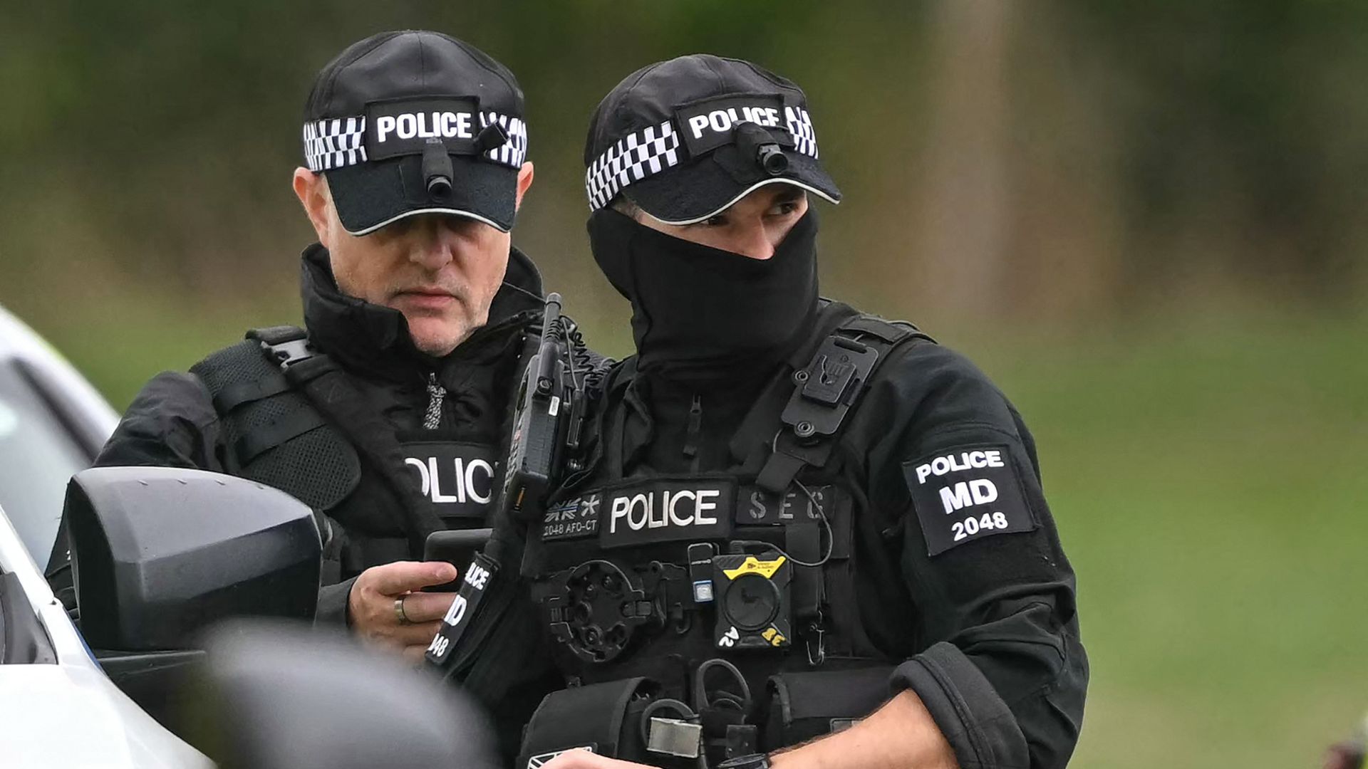 Police at a base set up at the Fairford Youth Football Club near RAF Fairford base, south-west England on September 27, as UK counter-terrorism police investigate the incident. /Justin Tallis/AFP
