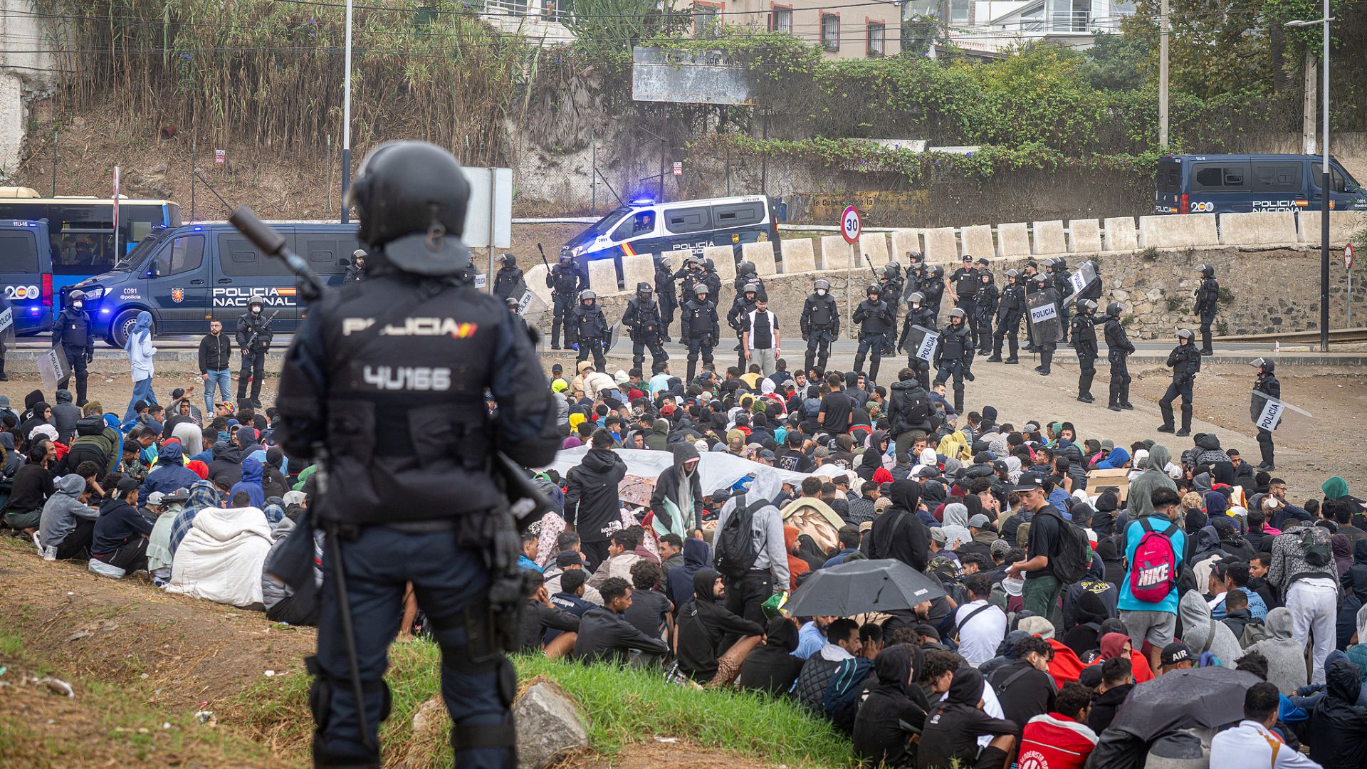 On October 4, 2026, in Ceuta, Spain, Spanish Civil Police officers evacuated a group of migrants gathered on El Trampolín beach, as the Ceuta migrant crisis continues to dog Sanchez. /Marcos Moreno/Europa Press via Newscom

