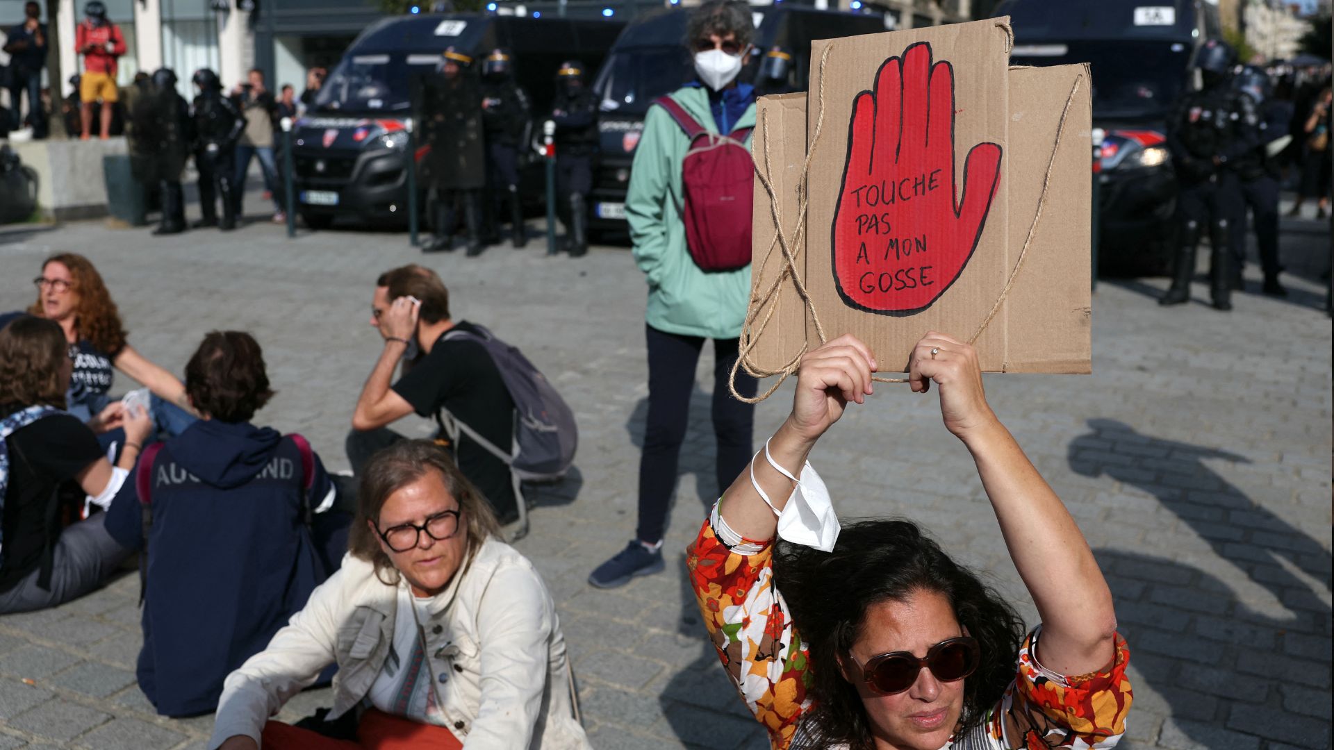 A protester holds a placard reading 'Don't touch my kid' during a demonstration of high-school students in Rennes, western France, on October 6. /Alain Jocard/AFP

