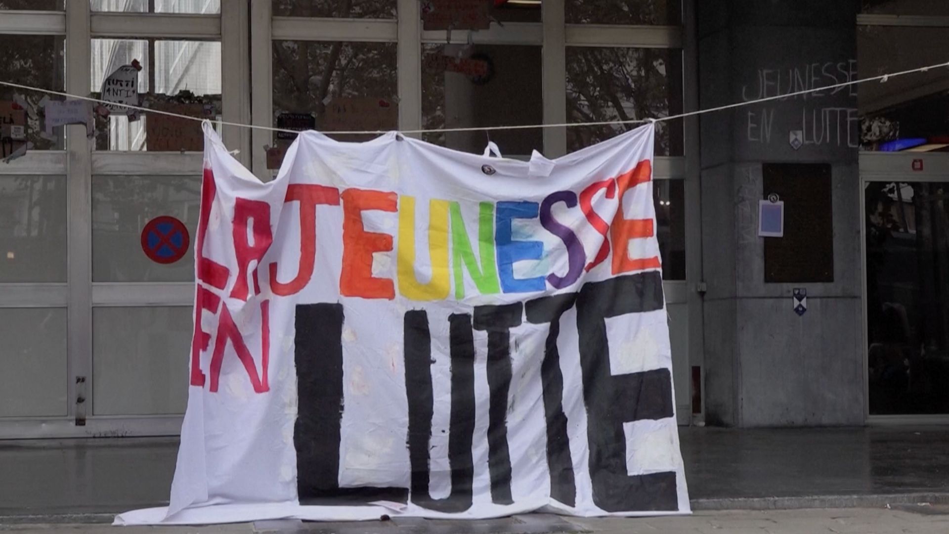 A colorful sign reading 'The Youth Struggle' hangs in Liege. /Reuters.