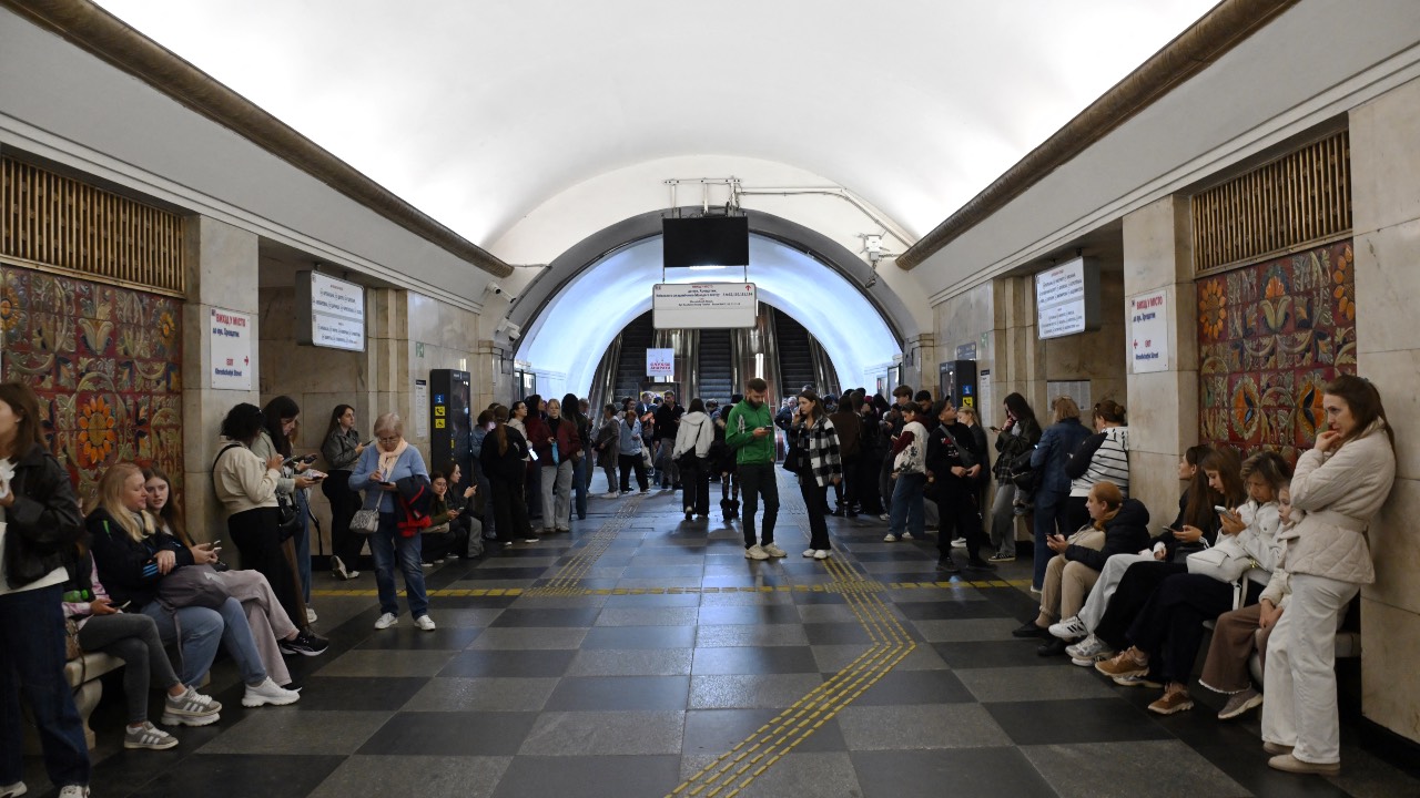 People shelter in a metro station during airstrikes and as underground trains are halted due to voltage reduction caused by attacks on energy facilities in the country, in Kyiv. /Sergei Supinsky/AFP