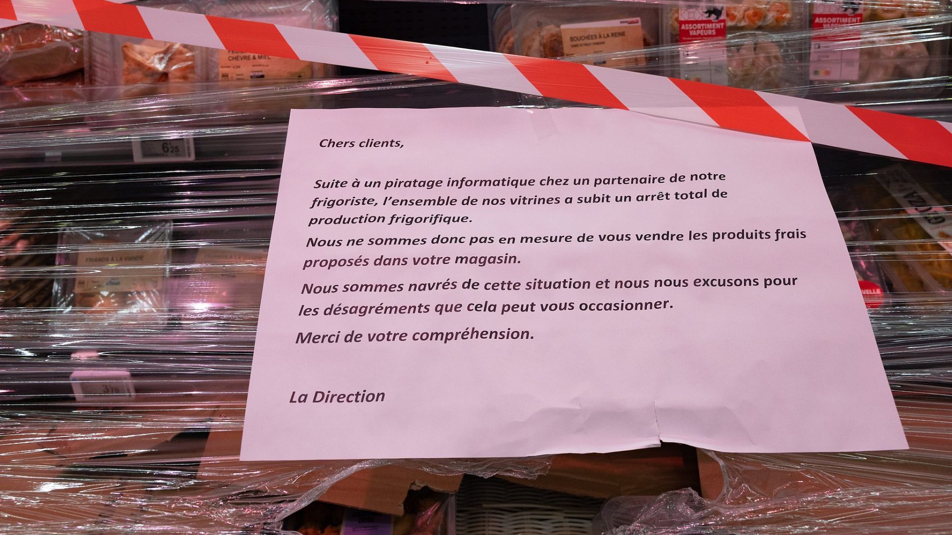 A sign apologises to customers, saying that due to an attack on a 