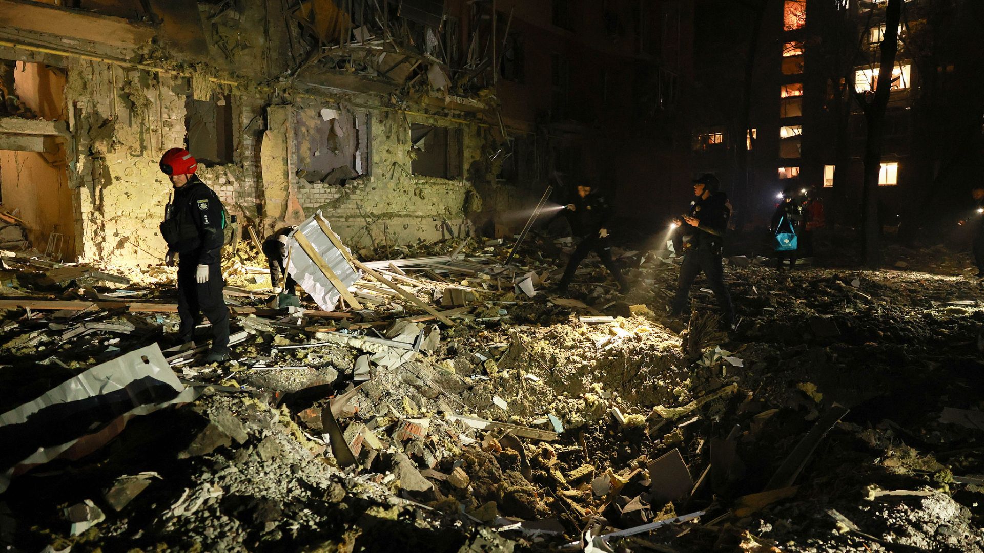 Rescue workers walk in front of a residential building damaged by a Russian airstrike in Zaporizhzhia, Ukraine, on Saturday, October 17, 2026. /CFP.