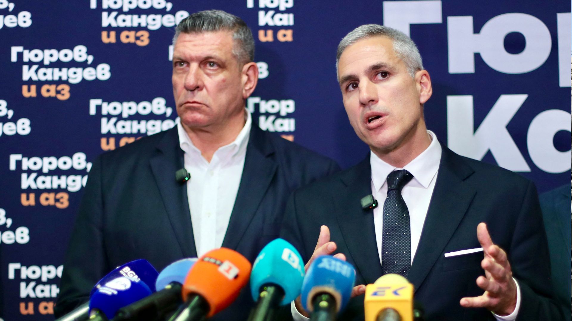 Bulgaria's former interim PM Andrey Gyurov (R) speaks alongside his vice-presidential candidate Georgi Kandev after the first exit polls. /Dimitar Kyosemarliev/AFP
